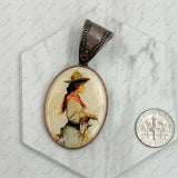 Copper metal oval cowboy pendent: COWBOY