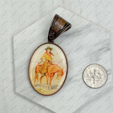 Copper metal oval cowboy pendent: COWBOY