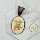 Copper metal oval cowboy pendent: COWBOY